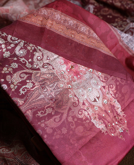 Rich maroon colour churidhar material adorned with elegant embroidery and intricate paisley patterns, complemented by a beautifully printed dupatta and plain bottom.