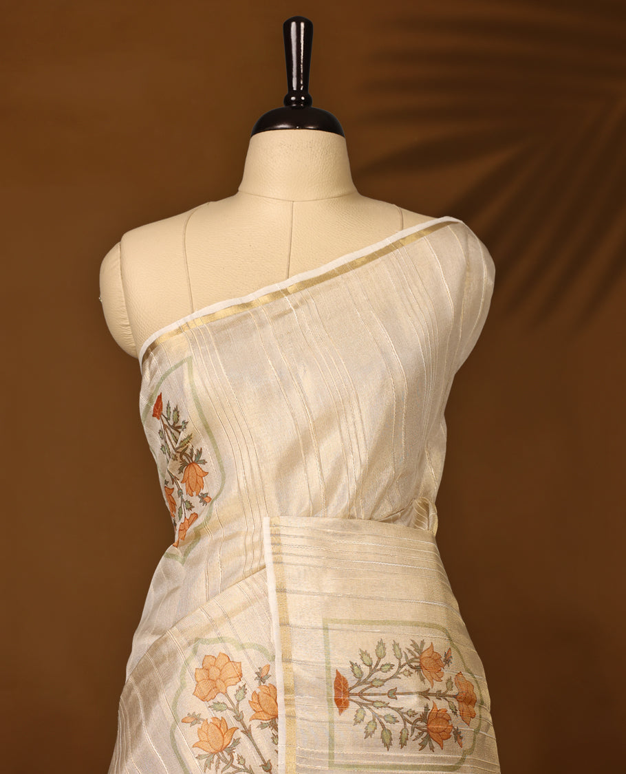 Ethereal offwhite colour organza Kerala saree with elegant orange floral embroidery and a subtle zari-style border, Lightweight and graceful, paired with a matching blouse, Perfect for festive and elegant occasions.
