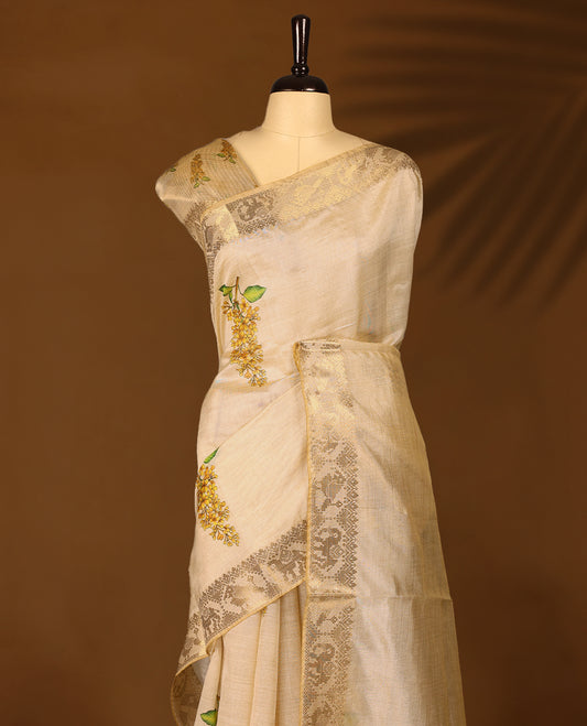Ivory tussar Kerala saree adorned with intricate floral Digital Prints, complemented by a rich zari border ,detailed pallu and a matching Blouse