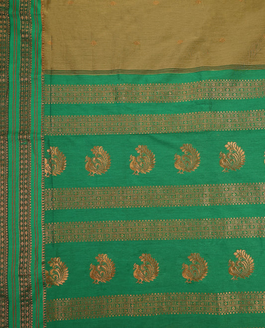 Warm olive and Green Kalyani cotton saree adorned with delicate woven buttas on the body, complemented by intricate zari woven border and pallu in green, paired with a matching blouse