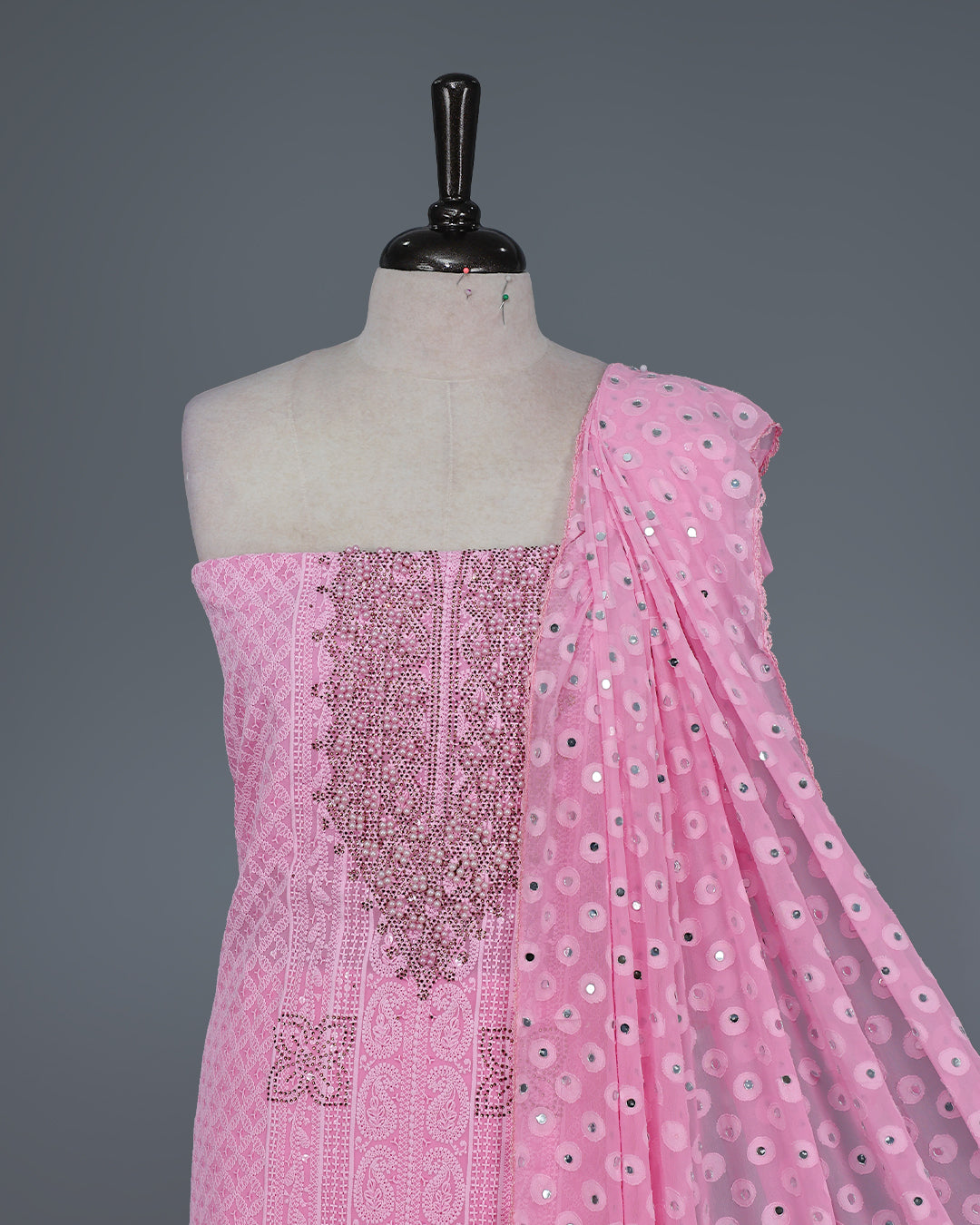 Pink Colour Georgette Salwar Material featuring elegant Chikankari work on the kurta, paired with a matching bottom and a sequins-embellished dupatta.