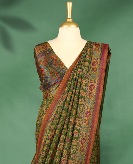 Grass green Colour Manipuri saree showcases a body with vibrant paisley and floral motifs, accentuated by a multicolour traditional printed border in golden yellow and maroon, and comes with a matching blouse.