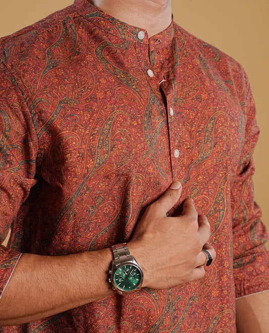 Brick Red colour men's kurta featuring elegant Print on the body, complemented by sleeves for a refined and festive look.