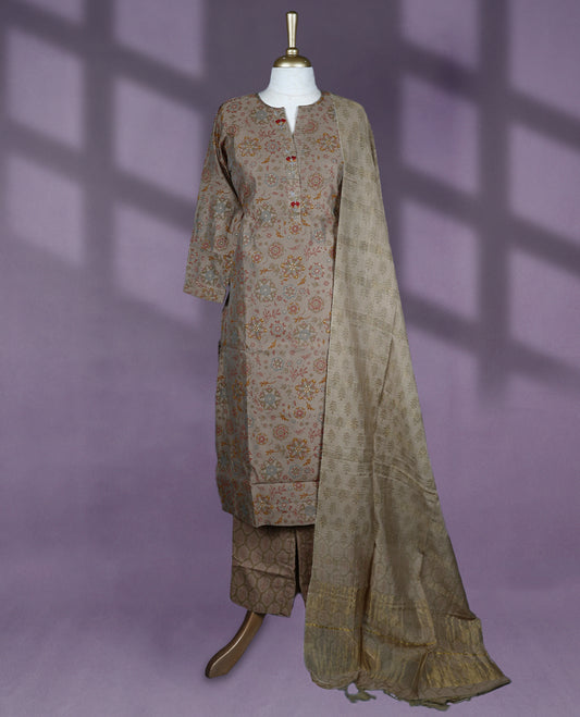 Earthy toned kurti set features a round split neckline with button detailing and straight three quarter sleeves, paired with printed pants and a complementing dupatta.