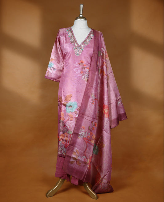 Pastel pink colour salwar from TWARA, featuring a V neck adorned with cut beads, beads, and thread work, with digital floral prints on the top, paired with a matching bottom and a digital printed dupatta.