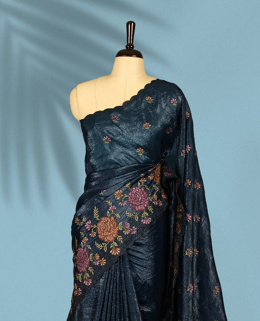 Midnight Blue Colour crush soft silk saree, textured body with a natural crinkled finish, adorned with intricate Multi colored floral Motifs and complemented by a delicate Multi Colour Bold Floral embroidery border, paired with a matching blouse