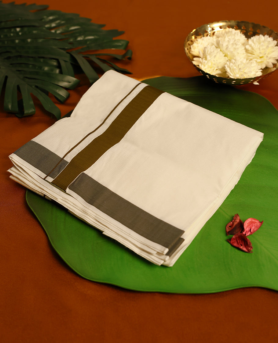 Light ivory Colour cotton single dhoti with 1.5 Inch Deep Olive kara, crafted for traditional elegance & comfort, for men.