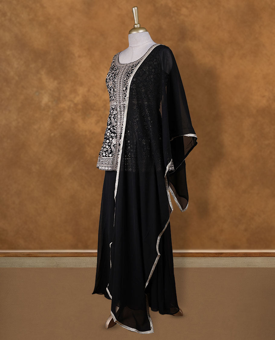 Black colour sharara set adorned with intricate light silver embroidery and sequins work & The fitted embellished top pairs beautifully with the flared bottoms and matching dupatta.