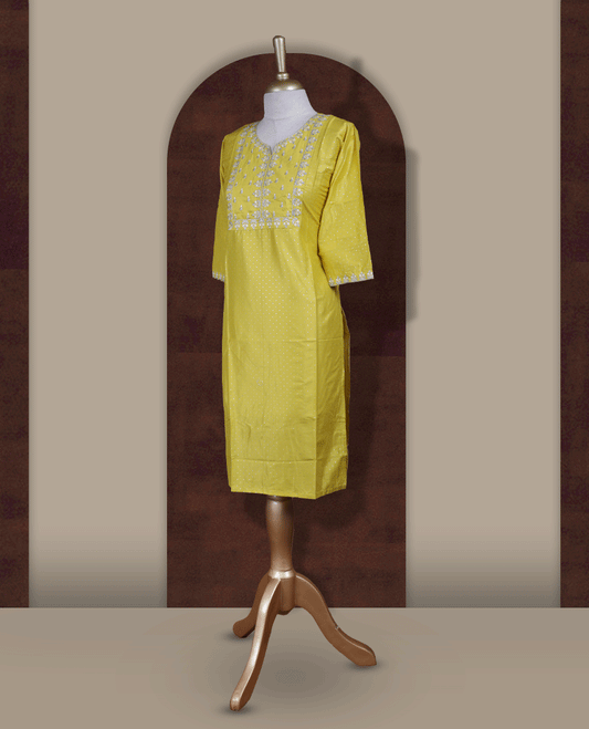 Bright yellow kurthi from TWARA , adorned with delicate white embroidery, featuring a stylish V-notch neckline and comfy 3/4th sleeves.