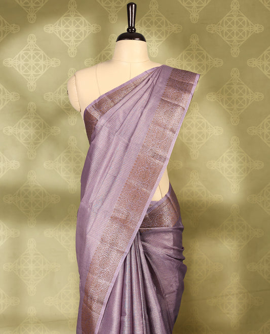 Pastel purple colour pure Banaras tussar silk saree with light gold zari small checked body, Self colour border featuring copper and silver antique zari traditional work, antique zari brocade pallu, with matching blouse.