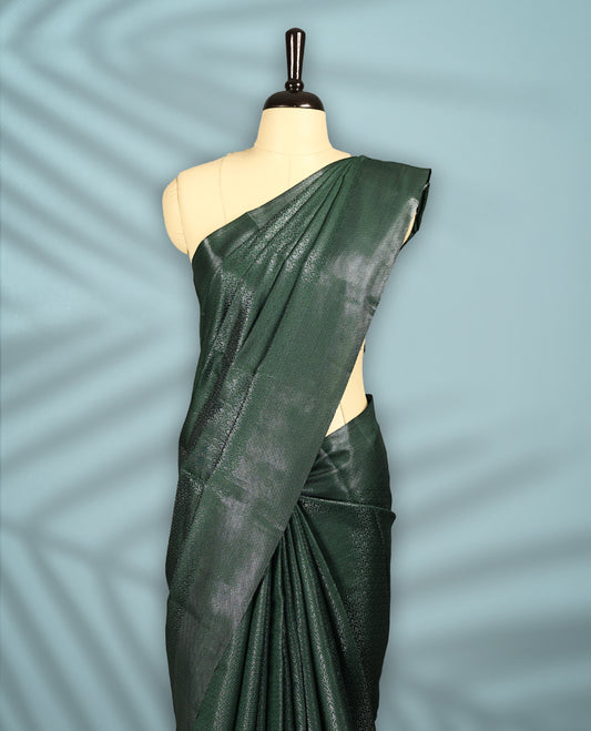 Deep Green Colour semi silk saree featuring an intricate Zari  motif weave across the body, paired with a zari worked border with matching blouse.