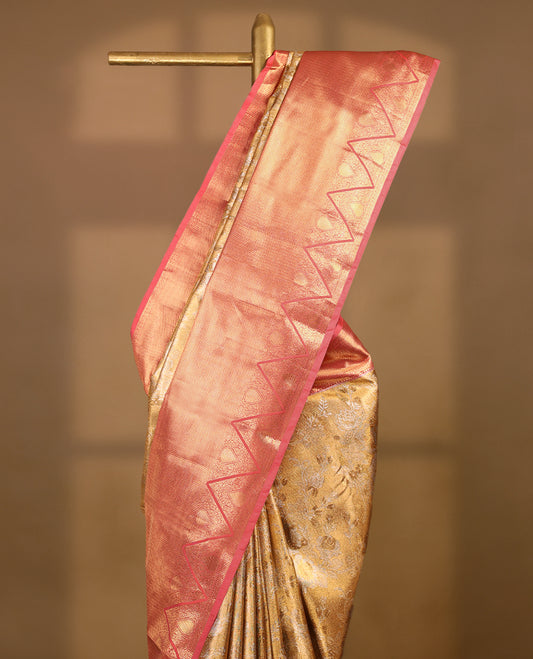 Gold colour tissue brocade saree with gold and silver zari floral pattern on body, gold zari traditional Piramide & thilakam work Blush Pink border, rich matching pallu with Antique zari motifs, paired with matching blouse.