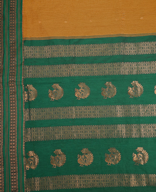Green and Mustard colour Kalyani cotton saree featuring zari woven patterns across the body, paired with a rich Green colour traditional zari border and pallu, with matching blouse