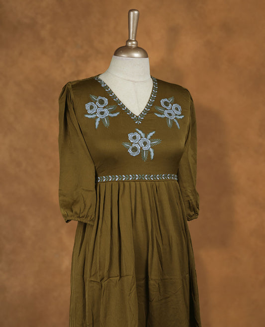 Olive green knee-length A-line dress with V-neckline, powder blue floral embroidery on yoke and hem, and elbow-length gathered sleeves