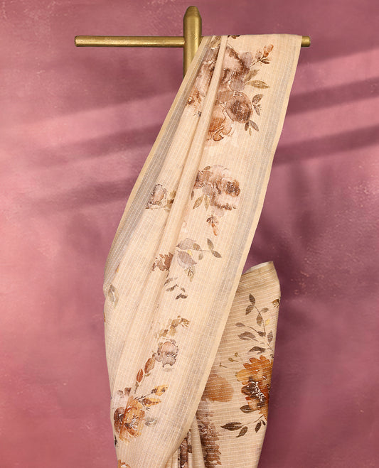Cream colour pure linen saree featuring elegant floral prints in earthy tones all over the body, finished with a minimal border and comes with a matching blouse