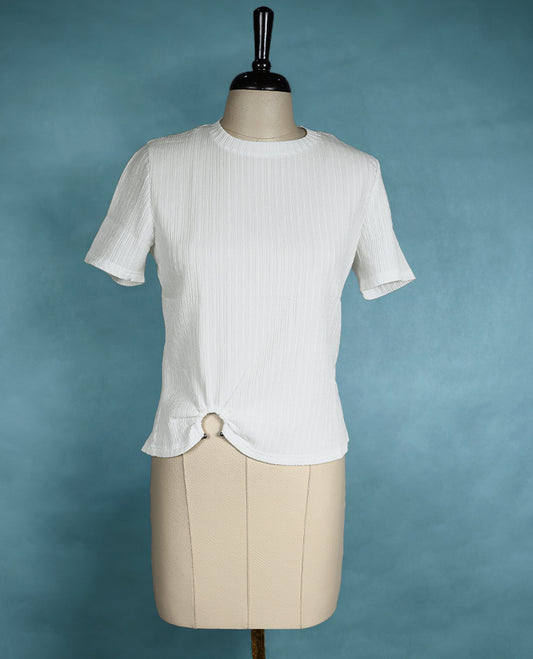 White textured short sleeve top featuring a crew neck and a front ring detail for a subtle, stylish twist.