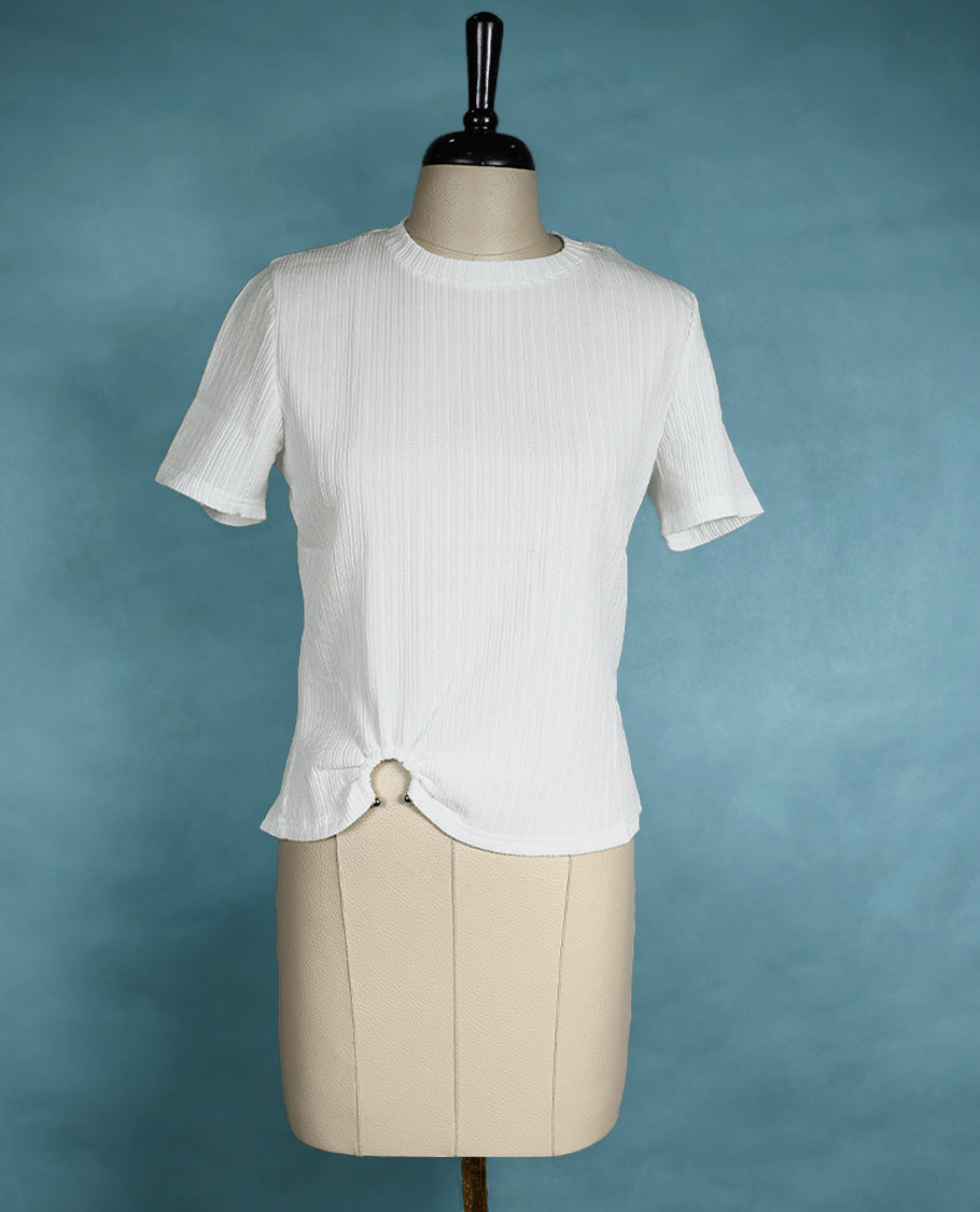 White textured short sleeve top featuring a crew neck and a front ring detail for a subtle, stylish twist.