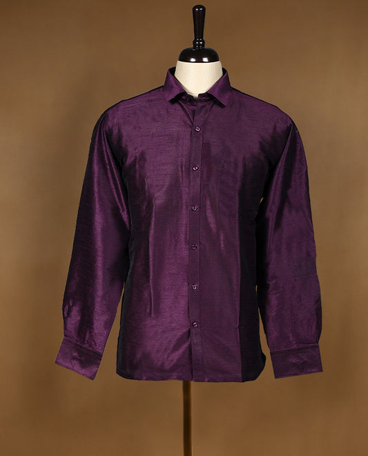 Rich wine purple colour men’s shirt in a relaxed formal fit, crafted with a glossy self textured finish, full sleeves, classic collar, and chest pocket ideal for festive or evening wear.
