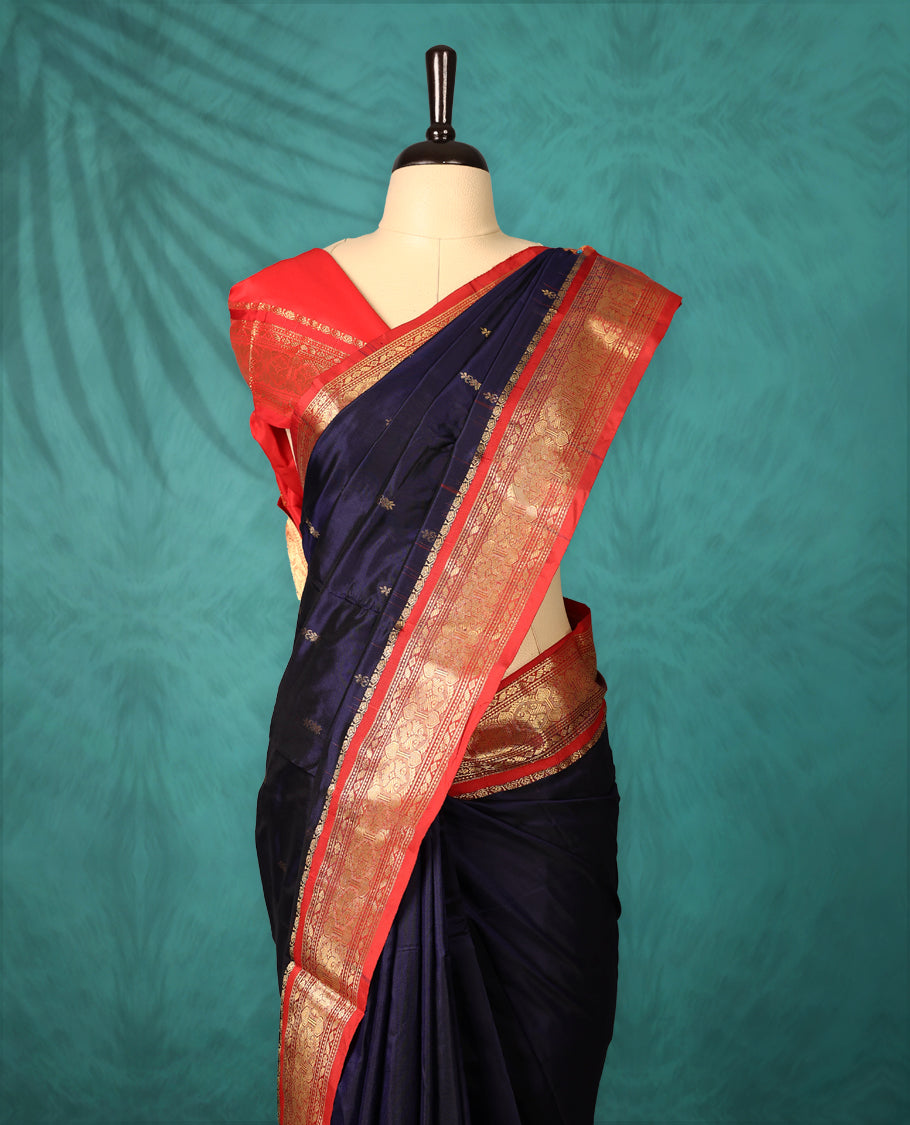 Navy Blue colour Dharmavaram saree with small gold motifs on body, Deep Red traditional border with intricate gold zari weaving, grand zari pallu, perfect for Bharatanatyam, with matching blouse.
