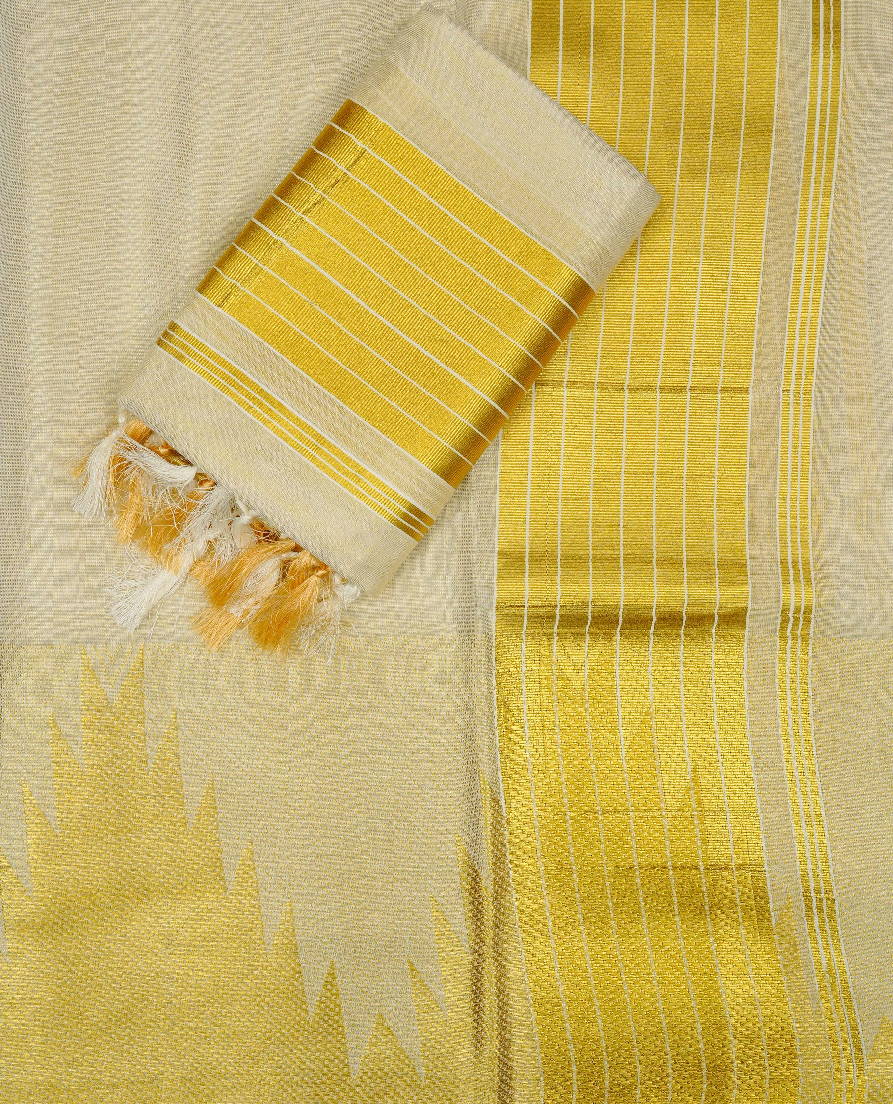 Cream Colour  tissue set mundu featuring a plain body, enhanced with Temple Border & a Striped gold zari kara.