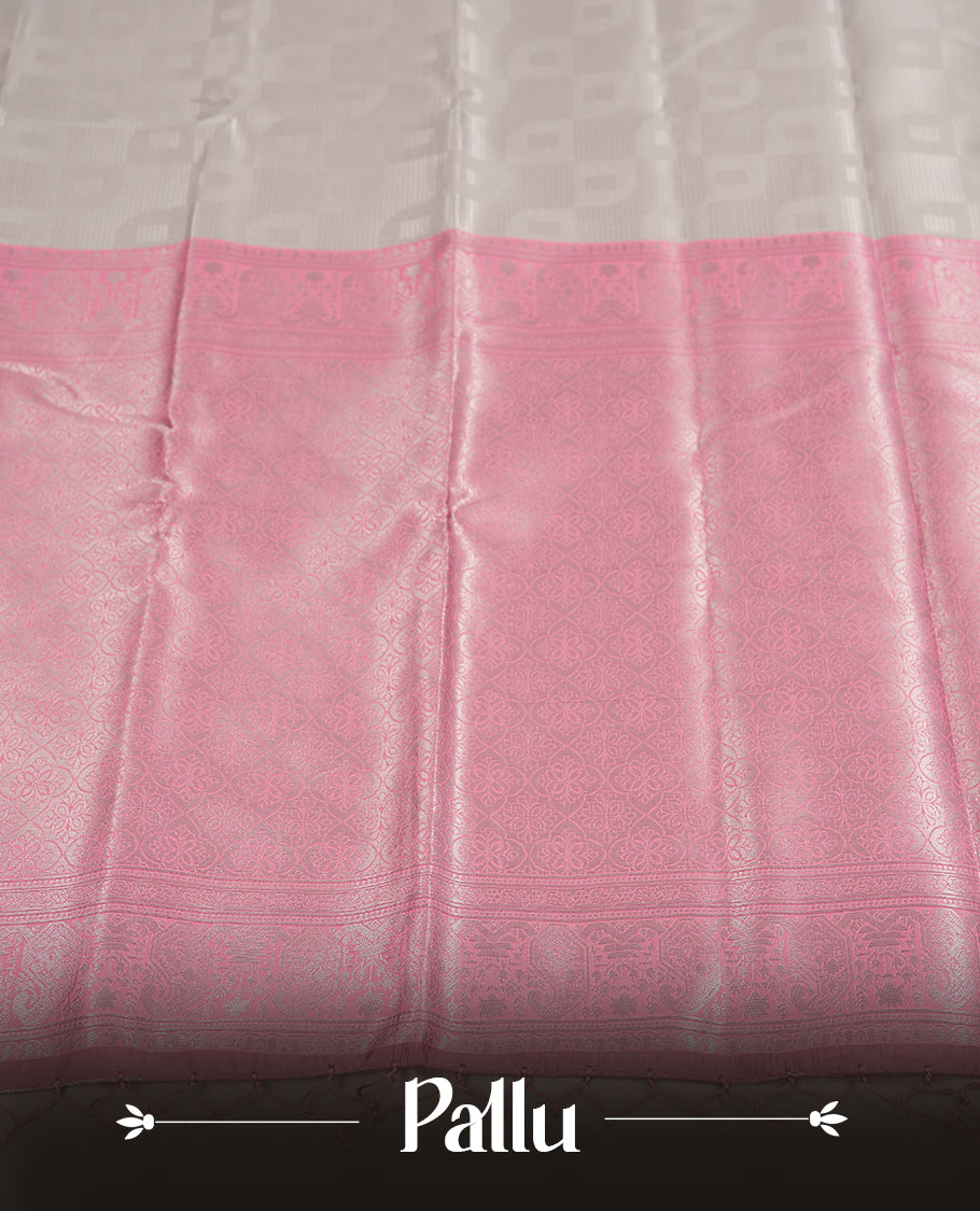 Silver Grey Colour Silk Saree with Self-Checked Geometric Patterns, Contrasting Pastel Pink Zari Woven Pallu and Border Featuring Floral Motifs and Tassels, Paired with Matching Blouse Piece