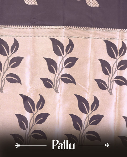 Black Semi Silk Saree with Rose Gold Satin-Finish Pallu Featuring Bold Leaf Motifs, Geometric Zari Edging and Tassels, Paired with Coordinated Blouse Piece