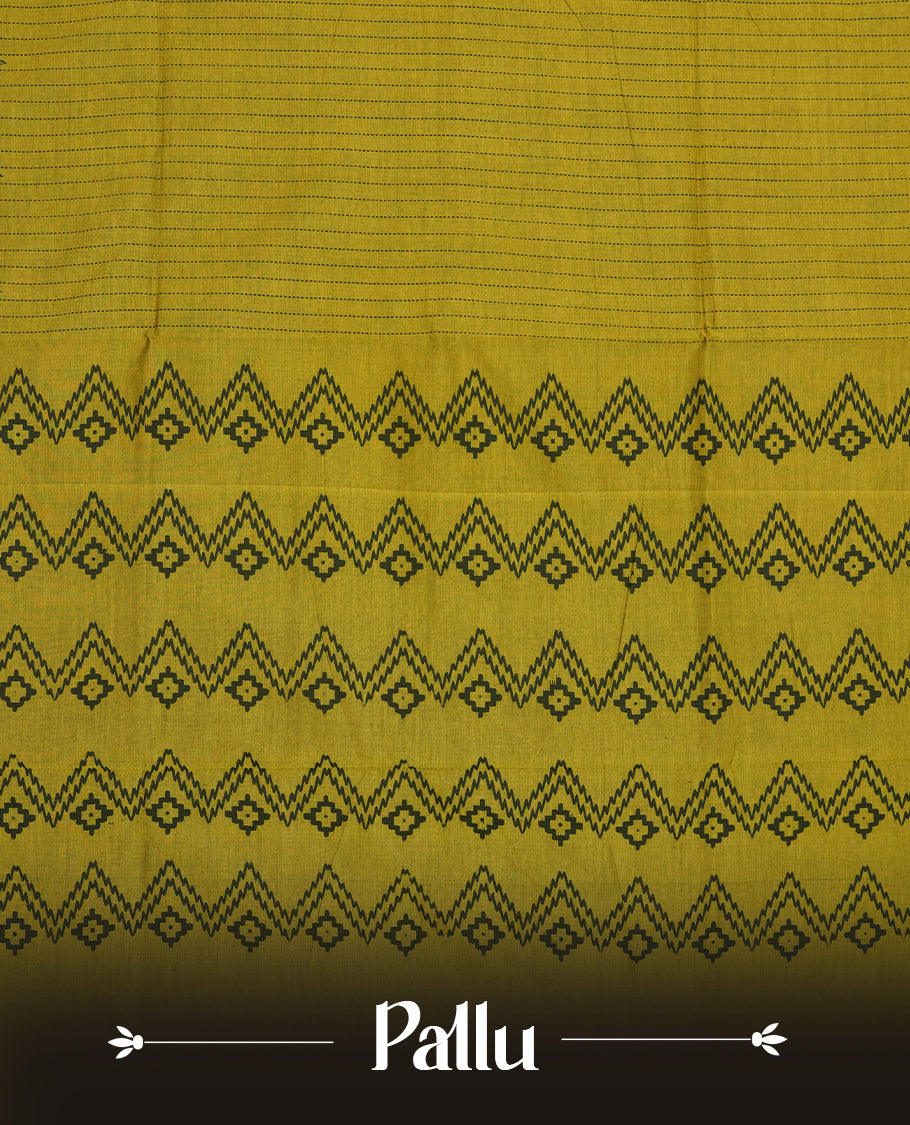 Olive Green colour poly cotton saree with black vertical dotted line pattern on the body, paired with a matching pallu featuring black zigzag geometric border, and a coordinated all‑over black stylised fleur‑de‑lis printed blouse piece.