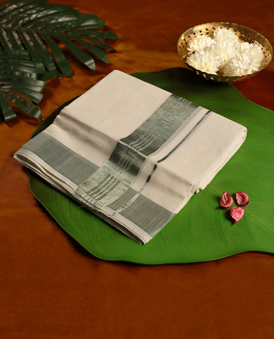 Off white pure handloom double dhoti featuring an elegant green kara with fine woven detailing, crafted in a soft traditional finish for comfort and grace, perfect for temple visits, cultural functions, and festive wear.