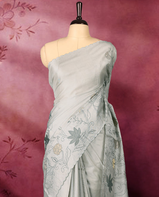 Pastel ash colour pure tussar silk lightweight saree with self colour floral kodi embroidery and tissue fabric applique work on the body, scallop embroidery worked border, with matching self colour plain blouse