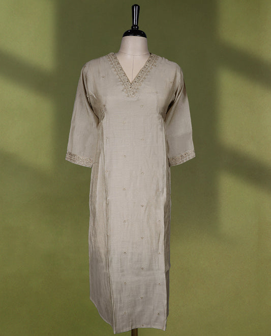 Beige colour Readymade kurti with embroidery and small thread buttas for women, featuring 3/4 sleeves.