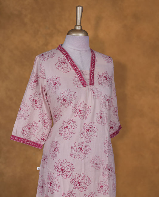 Light pink colour kurti BY VISMAY with floral prints, featuring a straight calf length silhouette, a V notch neckline with printed border, and three quarter sleeves.