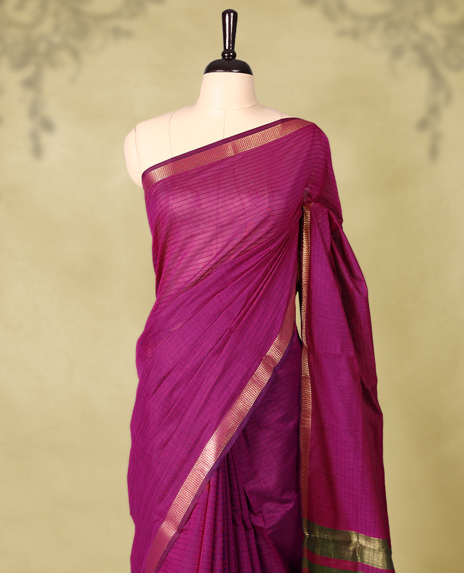 Deep Magenta colour chanderi cotton saree with fine striped body, mangalgiri border, grand pallu featuring Green and gold zari stripes, with matching blouse.