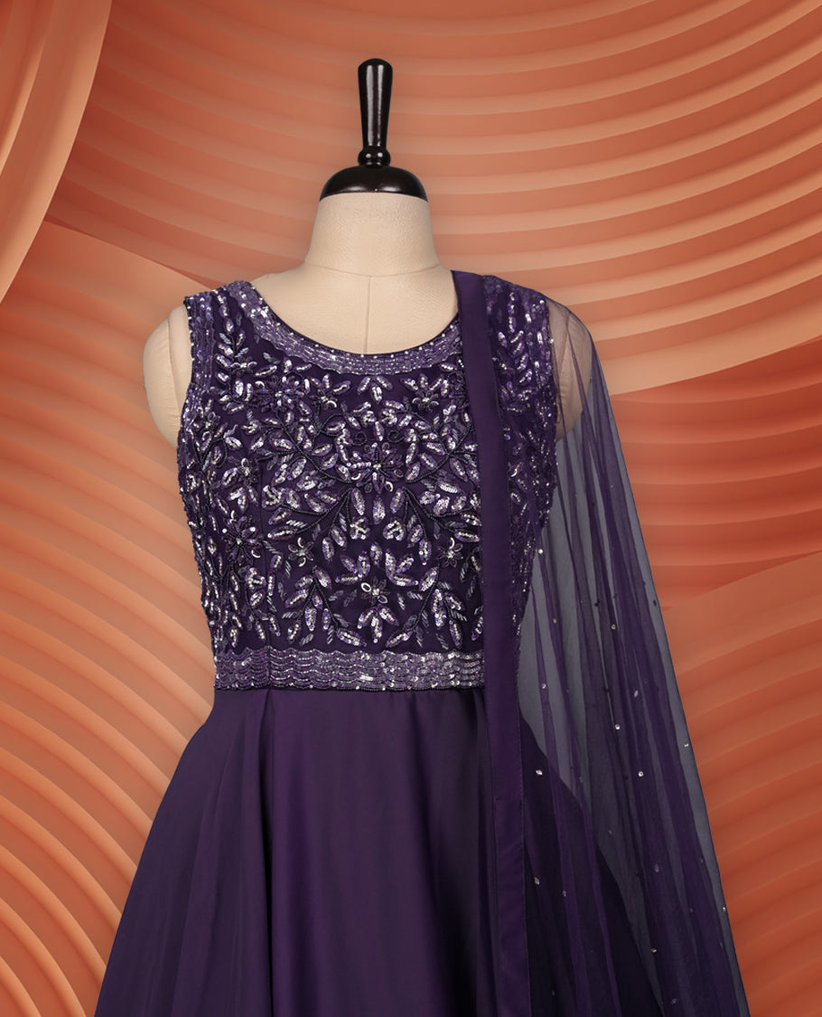 Graceful deep purple gown with a sleeveless sequin-embroidered bodice, flowing flared skirt, and a matching sheer dupatta adorned with delicate embellishments, ideal for parties and festive occasions.