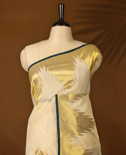 Elegant off white colour pure handloom soft tissue saree with golden zari detailing and green edging, Sheer, lightweight, and lustrous & paired with a matching blouse, perfect for weddings and festive occasions.