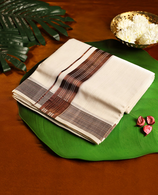 Off white colour pure handloom cotton double dhoti adorned with a rich brown woven kara in intricate patterns, crafted for traditional elegance, cultural pride, and all day comfort