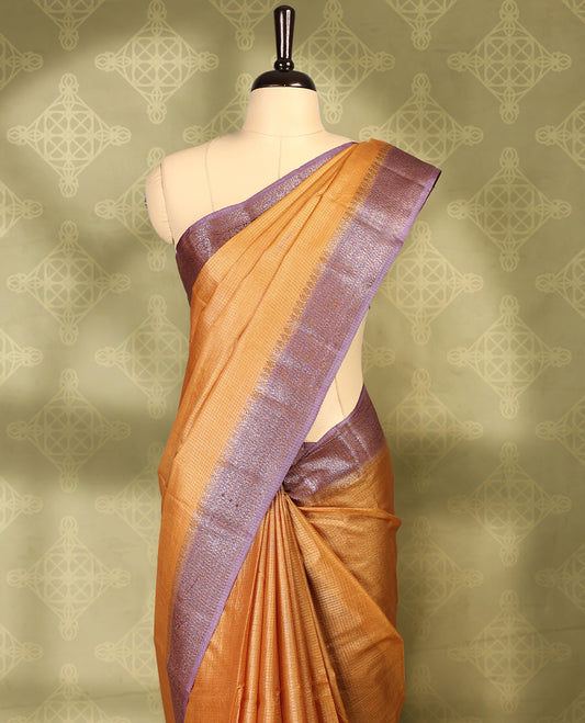 Rust Orange colour pure Banaras tussar silk saree with light gold zari small checked body, contrast purple border featuring copper and silver antique zari traditional work, antique zari brocade pallu, with matching blouse.
