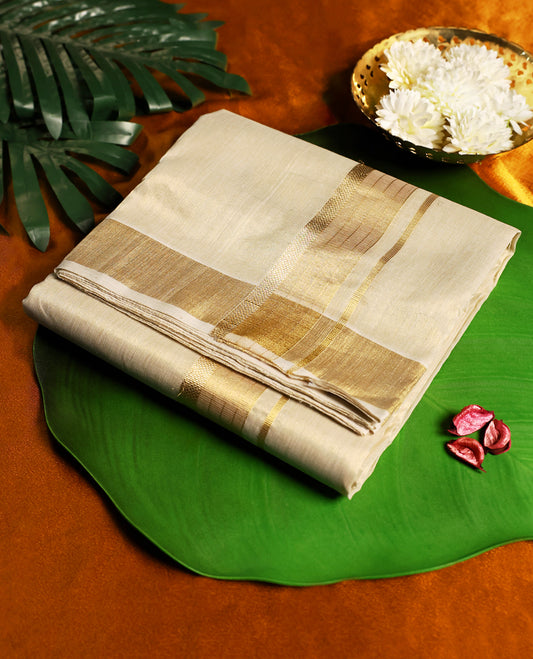 Classic pure handloom tissue double dhoti in an elegant cream shade, featuring a subtle golden zari border & A timeless blend of tradition and sophistication, perfect for weddings, festivals, and cultural occasions.