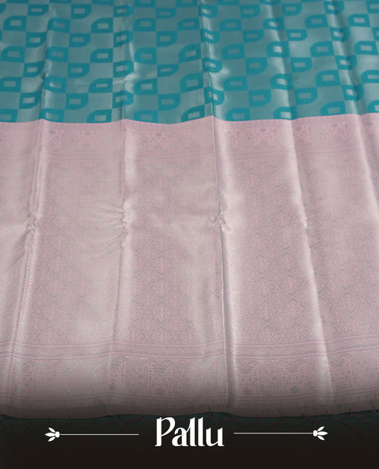 Teal Green colour Semi Silk Saree with Self-Checked Geometric Patterns on the Body, Contrasting Ice Silver Zari Woven Pallu and Border Featuring Intricate Paisley-Floral Motifs and Tassels, Paired with Coordinated Blouse Piece