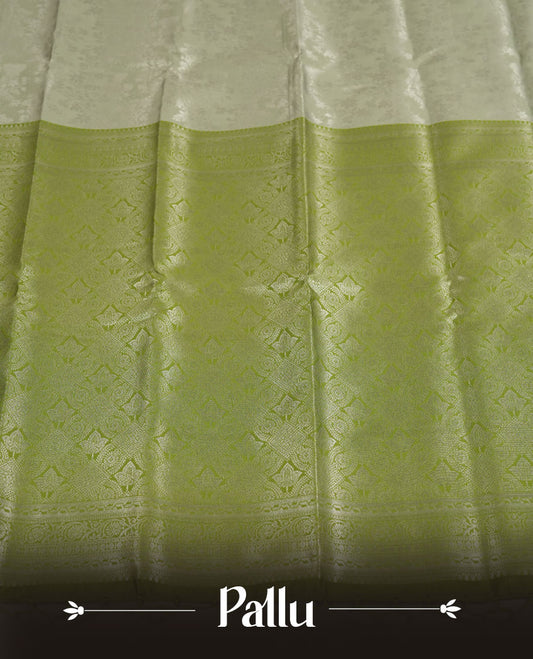 Pistachio Green colour Semi Silk Saree with Allover Subtle Floral Self-Weave on the Body, Contrasting Light Lime Zari Woven Pallu and Border Featuring Intricate Geometric Motifs and Tassels, Paired with Coordinated Blouse Piece