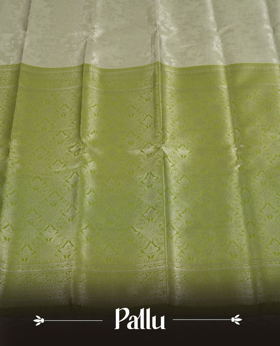 Pistachio Green colour Semi Silk Saree with Allover Subtle Floral Self-Weave on the Body, Contrasting Light Lime Zari Woven Pallu and Border Featuring Intricate Geometric Motifs and Tassels, Paired with Coordinated Blouse Piece