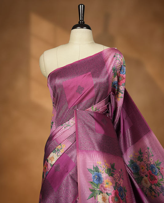 Grape colour semi tussar Banarasi saree featuring vibrant multi-color floral prints across the body, with geometric zari patterns, and a matching blouse detailed with silver woven buttas.