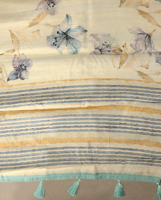 Cream colour semi silk printed saree adorned with soft Blue floral motifs across the body, finished with a soft Grey and light Brown striped border, with matching blouse