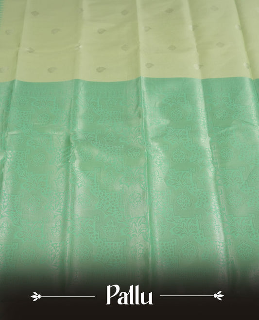 Light green colour semi silk saree adorned with silver leaf motifs on the body, complemented by a aqua green pallu intricately woven with rich floral patterns border and pallu, and paired with a matching blouse