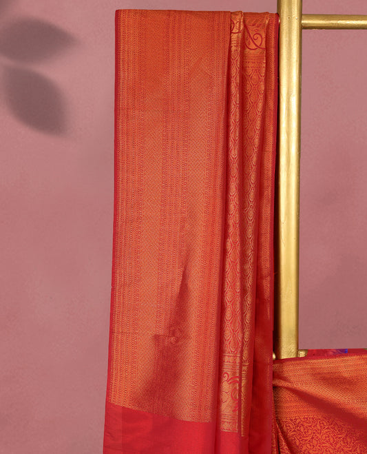 Chilli Red colour Kancheepuram saree featuring an antique zari brocade body, complemented by a traditional border and a matching blouse.