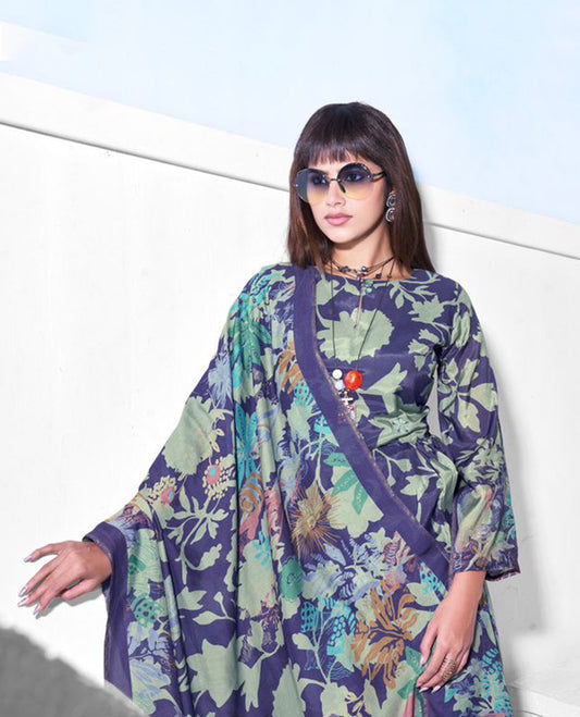 Navy blue colour pure muslin suit set featuring sage green digital floral printed top featuring sequin butti embroidery and a scalloped floral embroidered border, paired with a dyed pure viscose muslin bottom and a digital printed dupatta.
