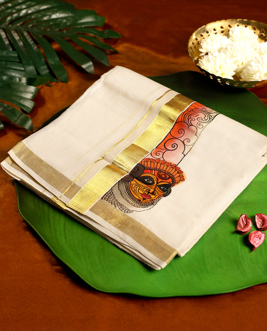 Off white handloom cotton double dhoti featuring a vibrant artistic border in orange and yellow with intricate motifs, complemented by a golden zari stripe for a festive appeal.