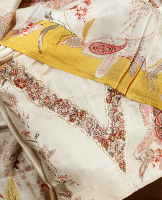 Cream colour churidhar material with pink floral and paisley prints, enhanced by a yellow border and delicate embroidery & Comes with matching plain bottom and dupatta.