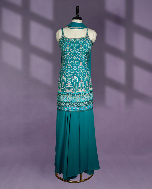 Stunning teal colour sharara set featuring intricate floral embroidery, flowy sharara pants, and a matching dupatta perfect for festive occasions