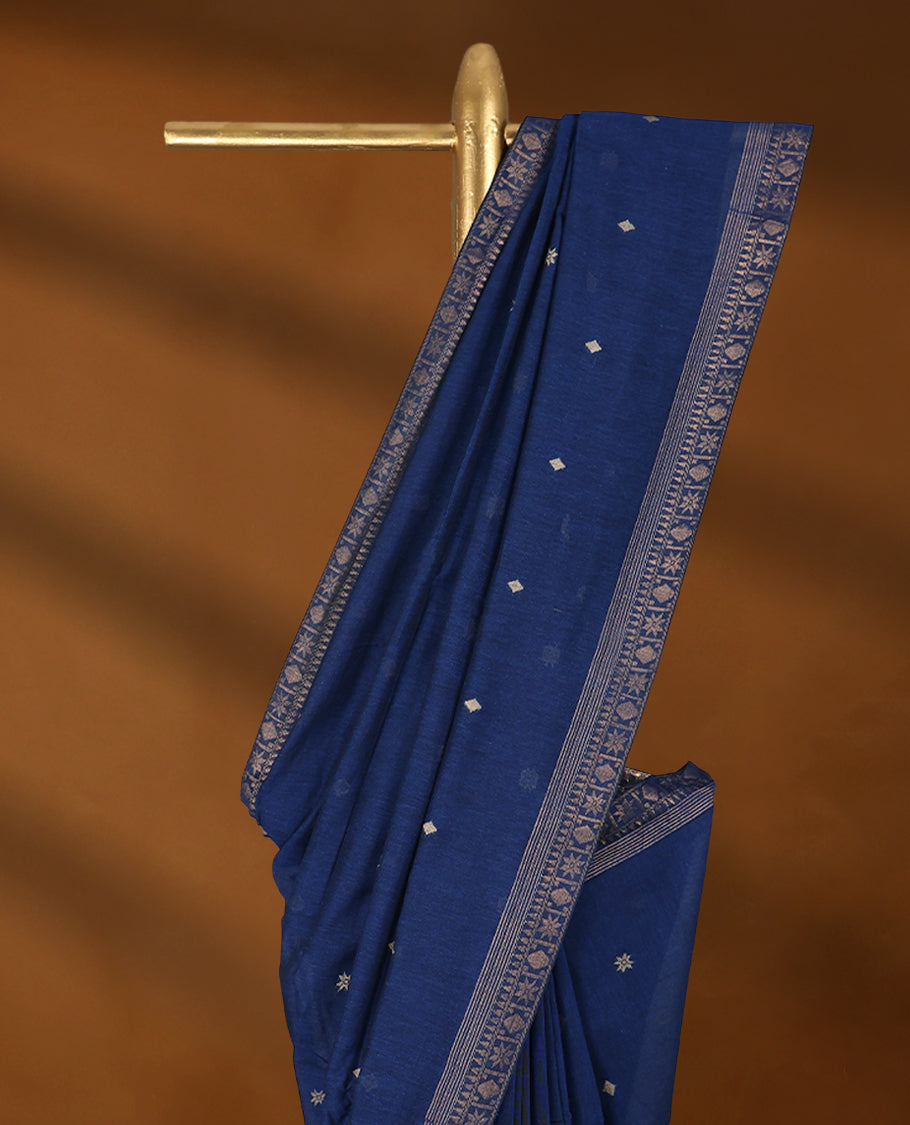 Deep Blue colour soft khadi cotton saree with Beige Zari motifs on the body, detailed woven Gold zari border, paired pallu with tussles, with matching blouse.