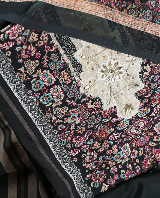 Black colour churidhar set featuring floral prints in pink, teal & beige, paired with plain black bottom and matching dupatta adorned with elegant embroidery.